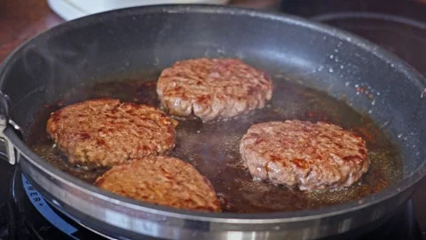 Frying Four Thick Beef Burger Patties In Frying Pan Stock Footage 311074790