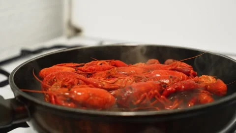 Frying Fresh Crayfish in Pan for Delightful Seafood Delicacy in Cozy Kitchen Stock Footage 303378147