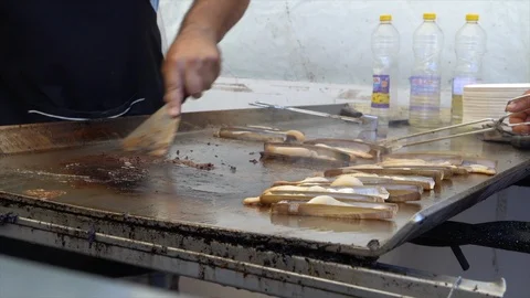 Frying fresh razor clams Stock Footage 100665164