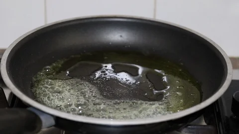 Frying fresh salmon in frying pan Stock Footage 105863508