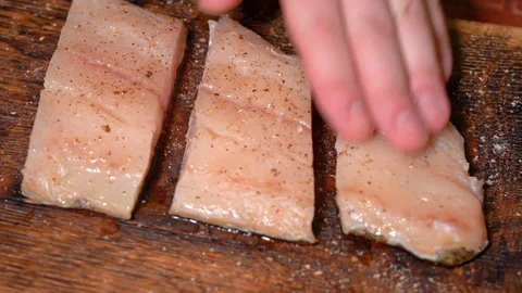 Frying fresh zander fillets, rubbed with spices for further fattening Stock Footage 253277116