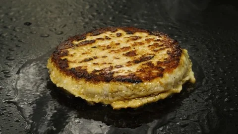 Frying a freshly made hamburger patty, takeaway food, 4K 60 FPS Stock Footage 76897586
