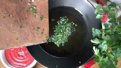 Frying Garlic And Parsley Video stock 74398461
