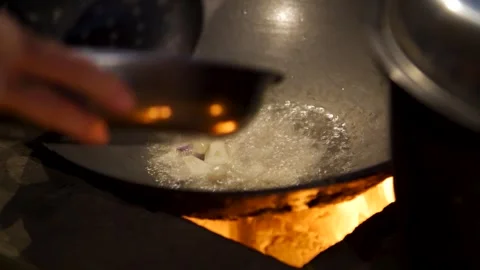 Frying garlic in a kitchen Stock Footage 277454998