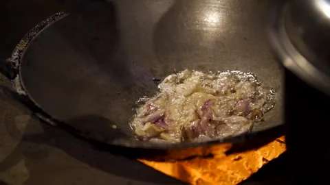 Frying garlic in a kitchen Stock Footage 277621033