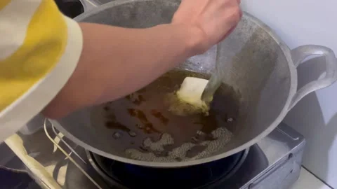 Frying gehu or indonesian deep fried tofu stuffed with vegetables Stock Footage 325971300
