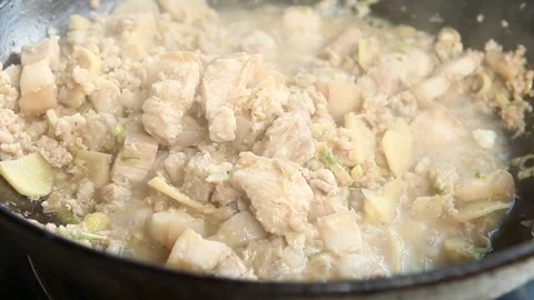 Frying  ginger with chopped pork and chili paste in pan, Chiangmai Thailand Video stock 163332273