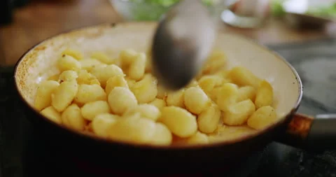 Frying gnocchi Stock Footage 244949299