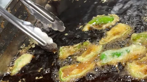 Frying Green Pepper Tempura in Bubbling Oil with Tongs, Japanese Food Culture Stock Footage 346276722