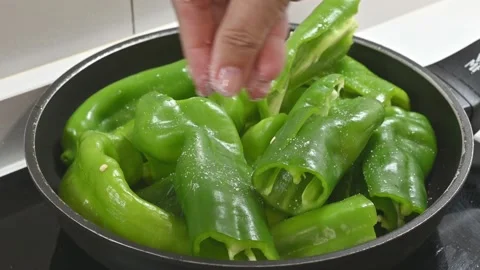 Frying green peppers in the pan Stock Footage 219674030