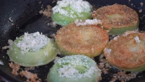 Frying up green tomatoes Stock Footage 140760409