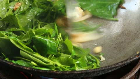 Frying gurmar vegetable with egg in pan, , Chiangmai  Thailand Stock Footage 116379859