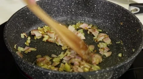 Frying ham and onion Stock Footage 49783734
