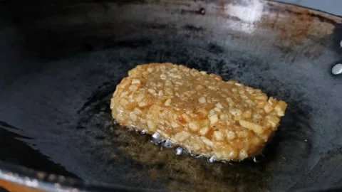 Frying Hash Brown Potatoes on a Frying Pan Stock Footage 241511426