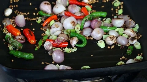 Frying herb in pan Stock Footage 83679622