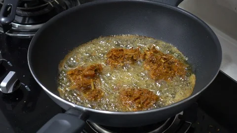 Frying a herbs chicken in a wok Stock Footage 101106460