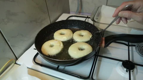 Frying homemade donuts Stock Footage 57462208