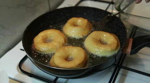 Frying homemade donuts Stock Footage 57462881