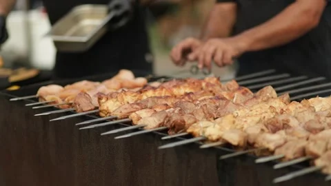 Frying kebab on the skewers in brazier. Fresh ruddy meat for barbecue grill on Stock Footage 280706502