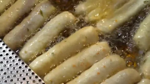 Frying Korean Fish Cakes (Eomuk) in a Professional Kitchen Stock Footage 337374886