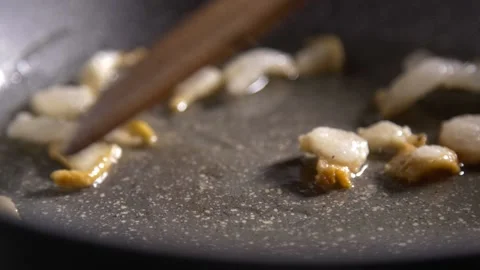 Frying lard pieces - slow motion close up Stockbeeldmateriaal 141992458