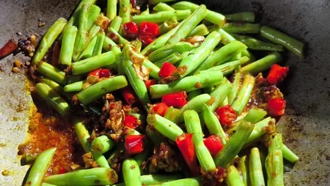 Frying long beans with chili paste in pan, in door  Chiangmai  Thailand. Stock Footage 293520905