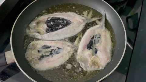 Frying marinated milkfish Video stock 222299035