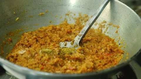 Frying masala in kadai for the vegetable Kofta curry an Indian Food, 4k footage Stock Footage 248490826