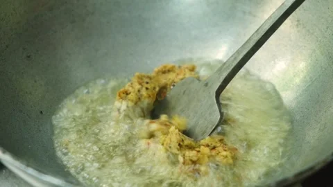 Frying masala in kadai for the vegetable Kofta curry an Indian Food, 4k footage  Stock Footage 248490936