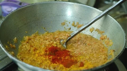 Frying masala in kadai for the vegetable Kofta curry an Indian Food, 4k footage, Stock Footage 248491022