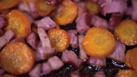 Frying meat and vegetables in pot. Stock Footage 72132800