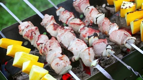 Frying meat and zucchini on a skewer Stock Footage 53847653
