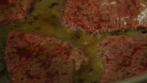 Frying meat CU Stock Footage 10681391