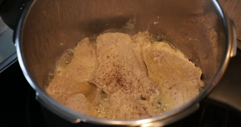 Frying meat in deep metal pan 5.7K footage Stock Footage 297263219