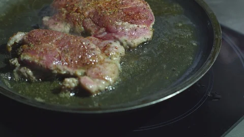 Frying meat in a frying pan Stock Footage 93803309