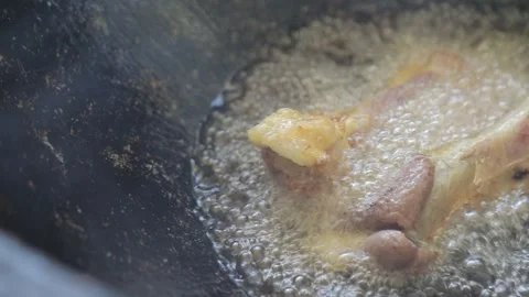 Frying meat in oil ( close-up) Stock Footage 145549360