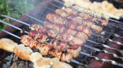 Frying meat on skewers Stock Footage 51686000