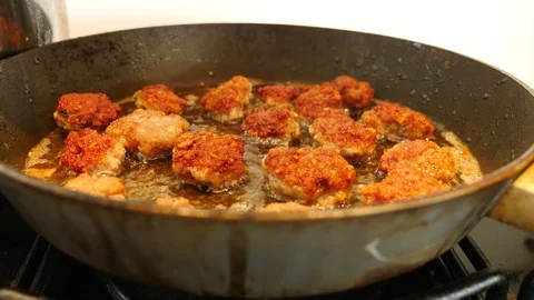 Frying Meatballs in the deep hot oil in the frying pan Stock Footage 111921472