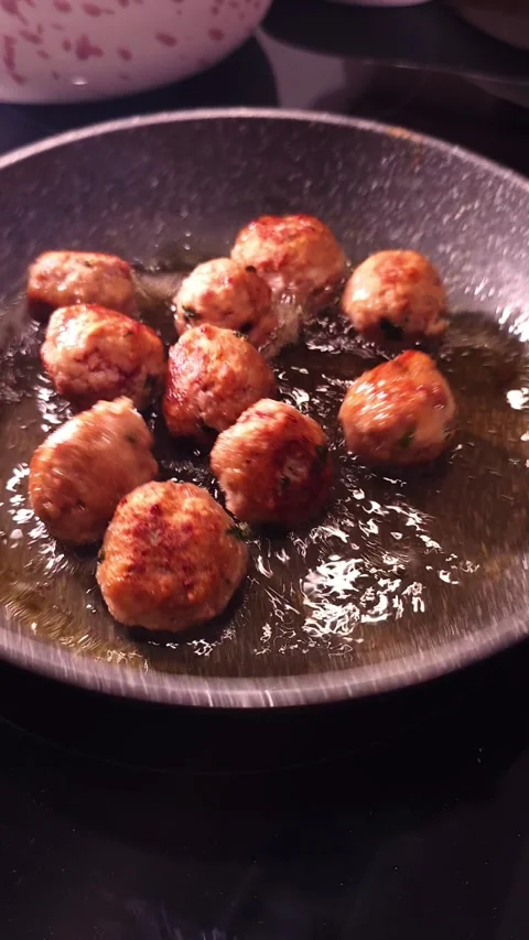 Frying meatballs in slow motion shot. Stock Footage 345041439
