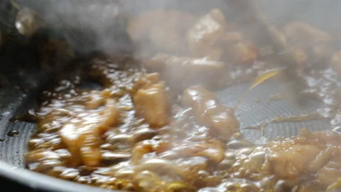 Frying meet in pan with sauce Close up Cooking. Stock Footage 131054512