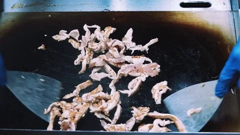 Frying meet in slow motion chef cooking special meal Stock Footage 80186540
