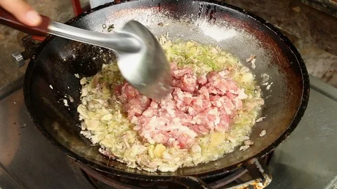 Frying minced pork with herb in pan Stock Footage 92484493