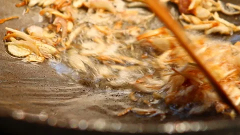 Frying minced red onion in pan, indoor Chiangmai Thailand. Stock Footage 145706662