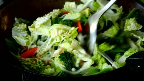Frying mixed vegetables  with chopped  chickens in pan, in door Chiangmai Thaila Stock Footage 263001162