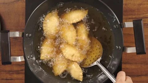 Frying Moong Dal Gujiya Stock Footage 83071959