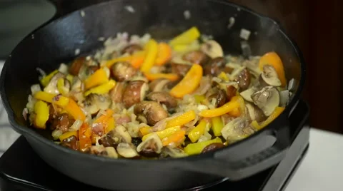 Frying mushrooms with ingredients. Stock Footage 54782024