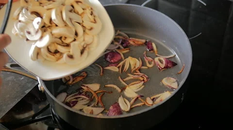 Frying Mushrooms with Onion Stock Footage 40338255