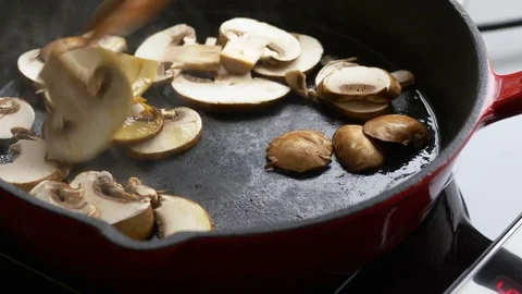 Frying mushrooms in a pan Stock Footage 71249958
