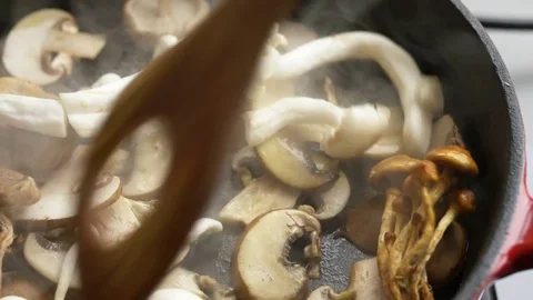 Frying mushrooms in a pan Stock Footage 71250217
