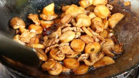 Frying mushrooms with pork in pan Stock Footage 95673689